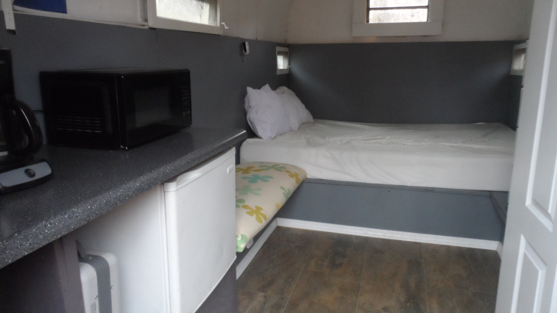 Camo trailer interior view of kitchen